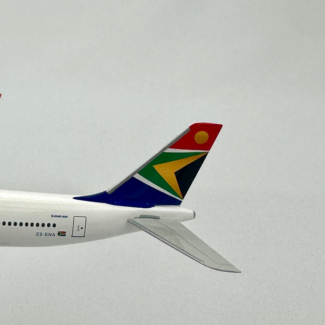 Close-up of an airplane tail with a colorful logo against a clear sky