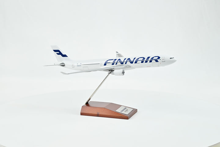 Detailed close-up of Finnair logo on Airbus A330-300 model