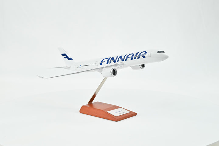 Collector's Finnair Airbus A350-900 1:200 model displayed on wooden stand